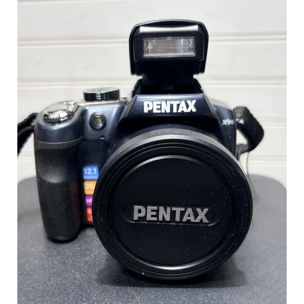 Pentax X90 12.1MP Digital Bridging Camera w/manual, Battery, Charger & Strap